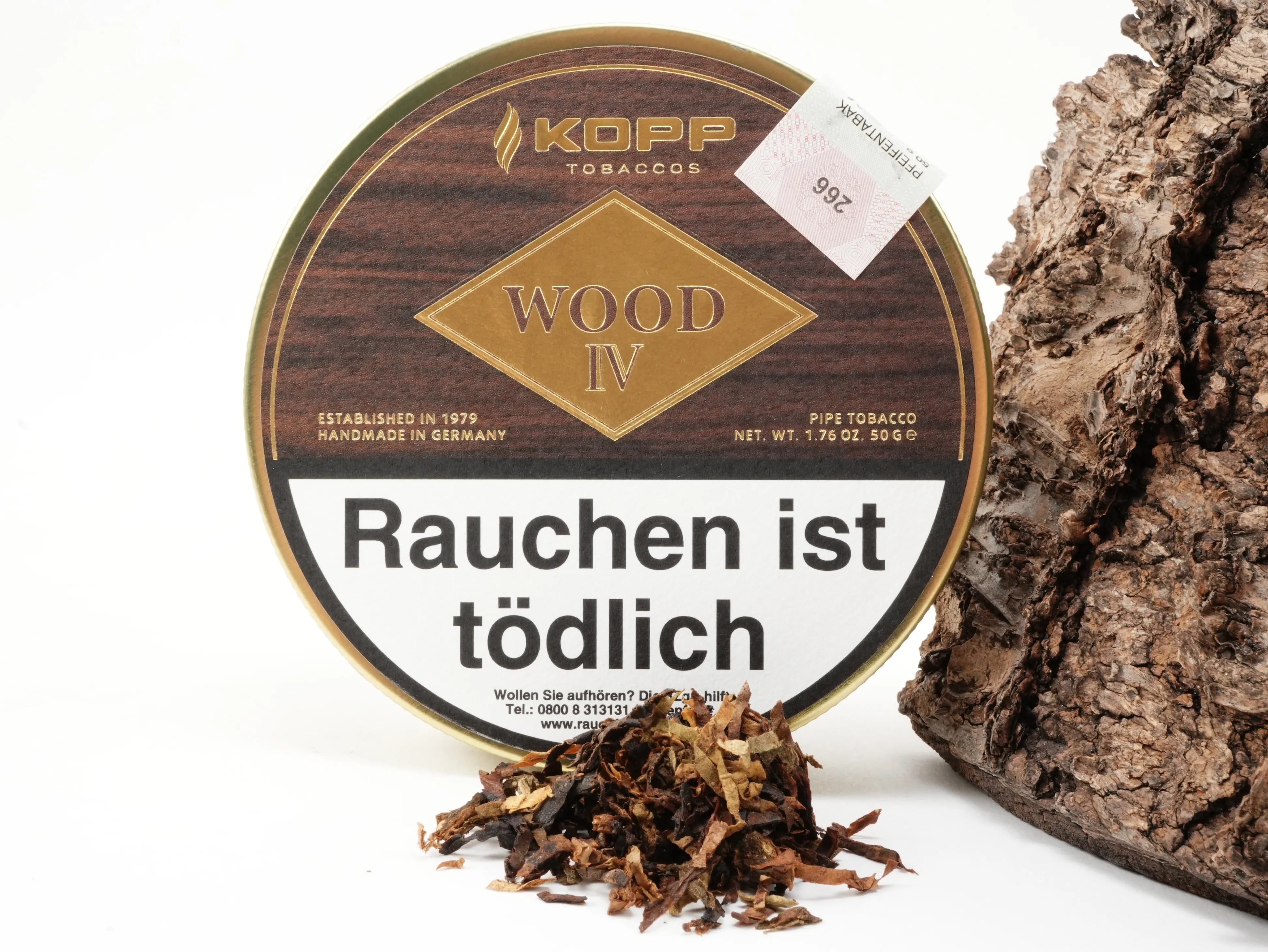 Kopp Wood IV Tabakdose im Hintergrund mit präsentiertem Tabak-Blend im Vordergrund