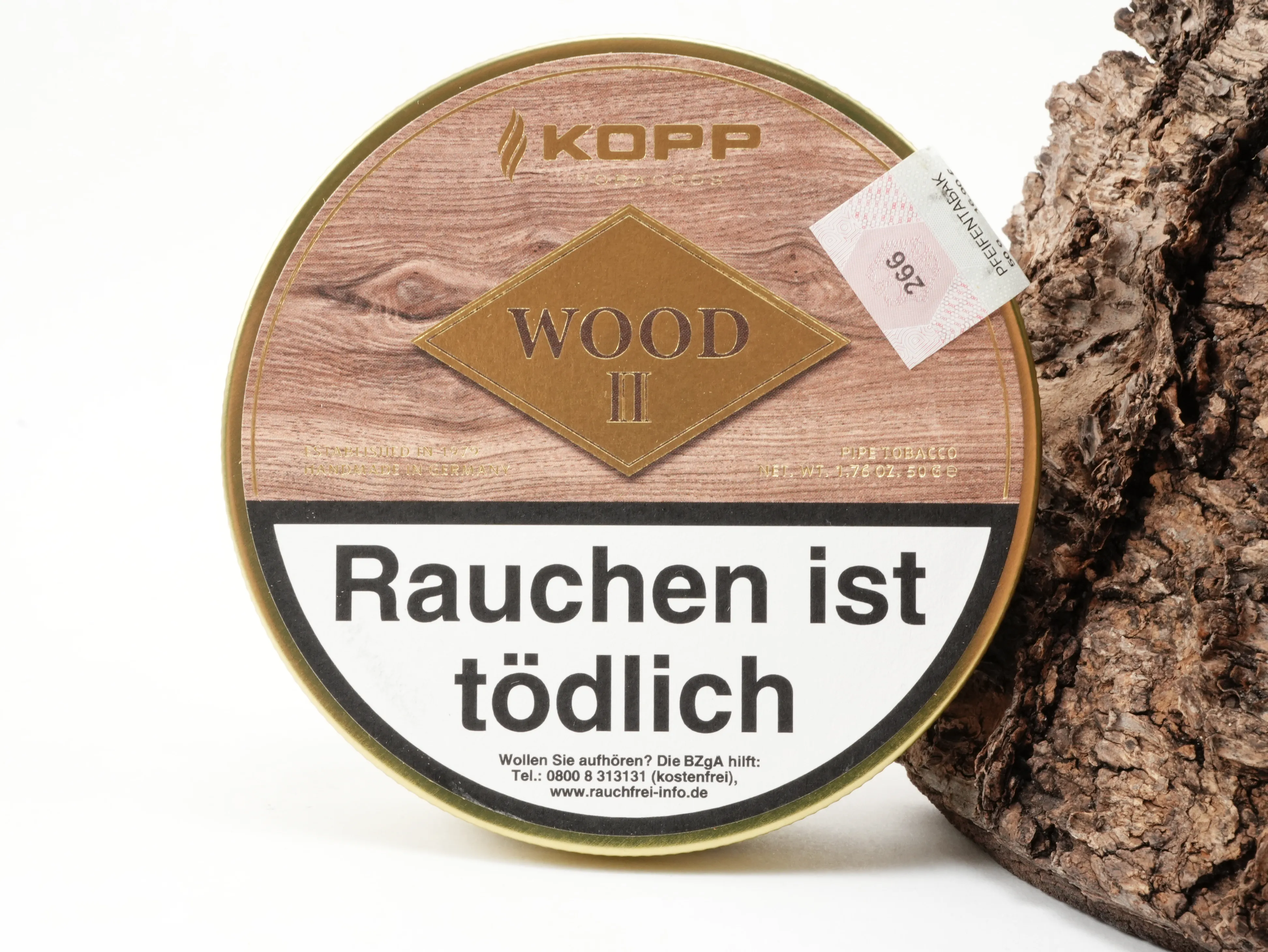 Runde Kopp Wood II Pfeifentabak Dose in heller Holzoptik vor Rindenhintergrund – Titelbild