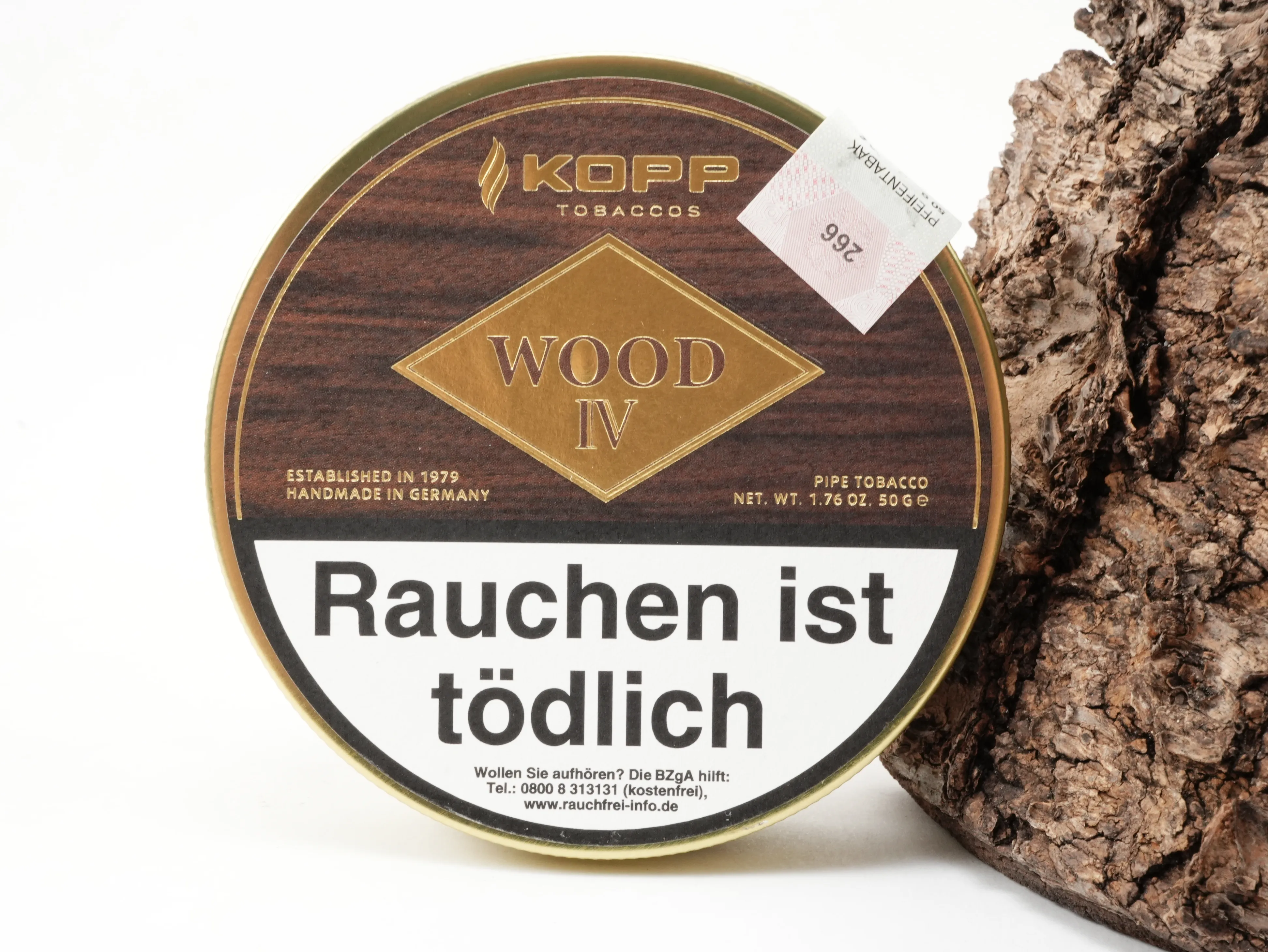 Runde Kopp Wood IV Pfeifentabak Dose in dunkler Holzoptik vor Rindenhintergrund – Titelbild