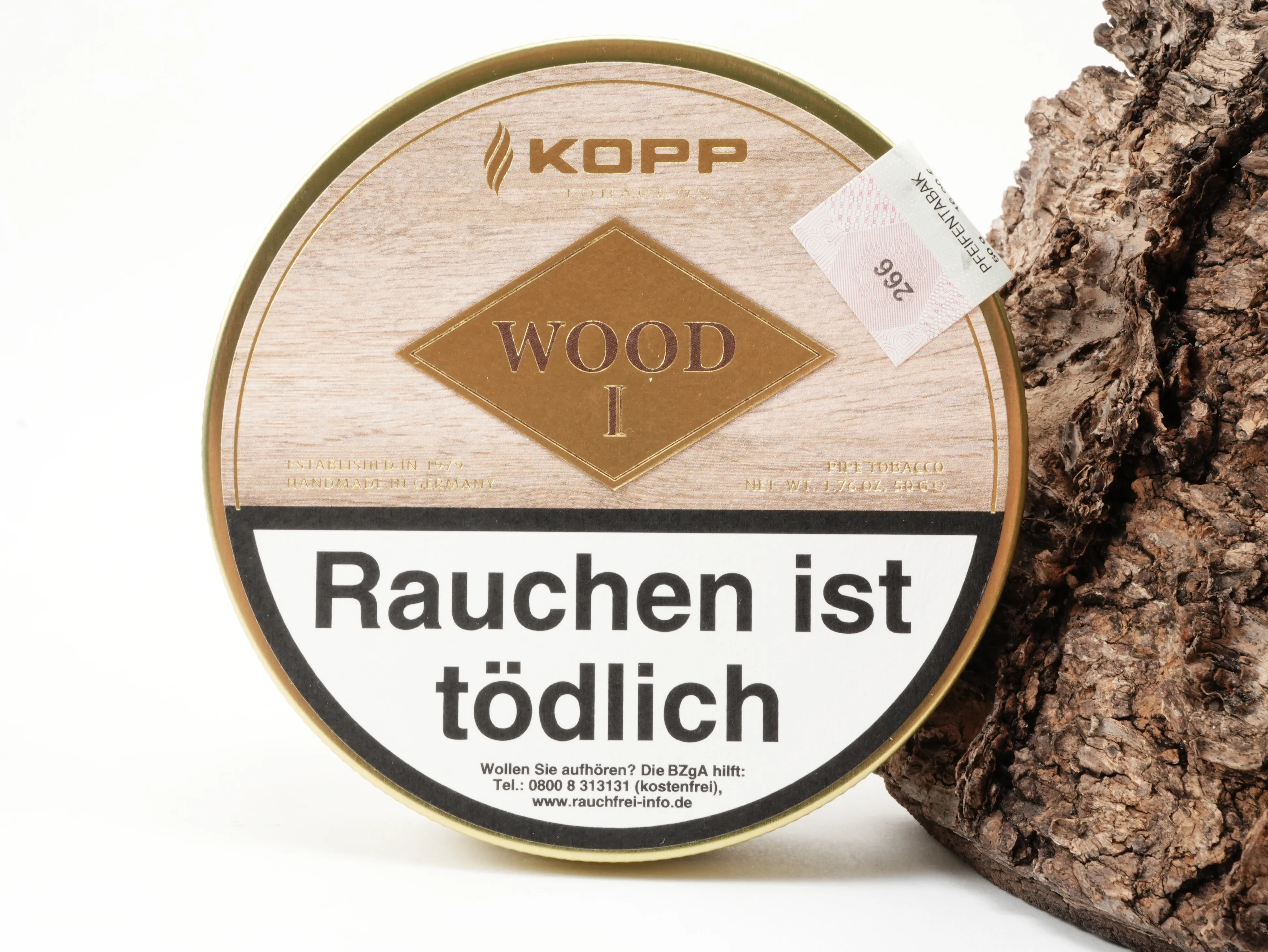 Runde Kopp Wood I Pfeifentabak Dose in Holzoptik vor Rindenhintergrund – Titelbild